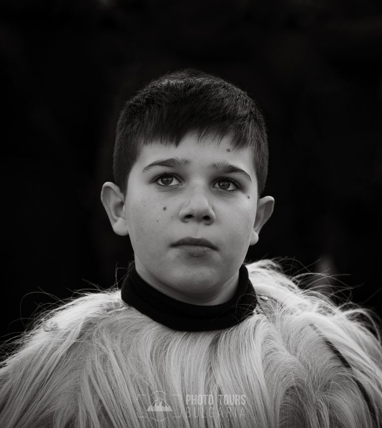 Boy with traditional costume at Surva festival Bulgaria