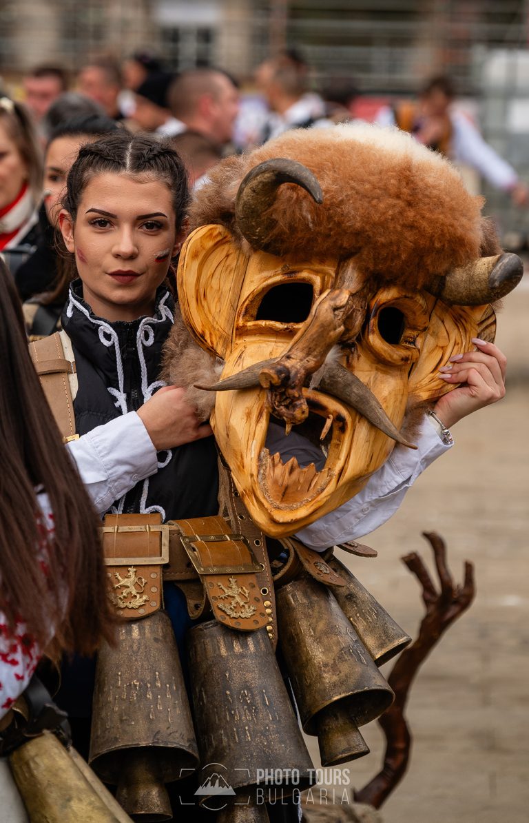 Young lady with scary mask at Surva festival