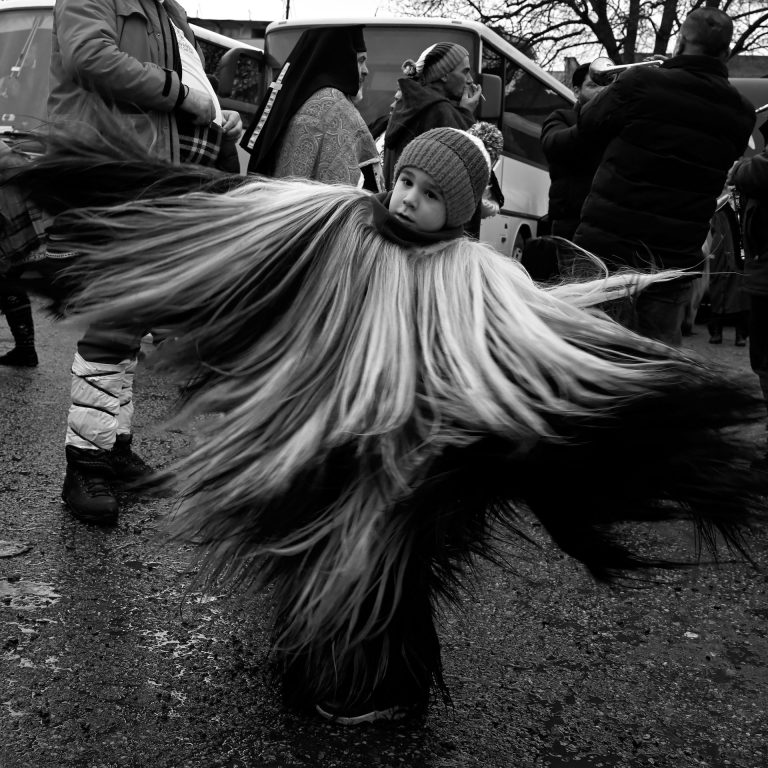 Boy with traditional costume at Surva festival Bulgaria