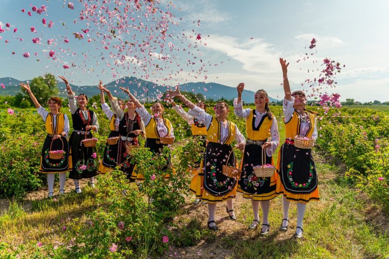 Girls throwing rose petals at Rose festival Bulgaria