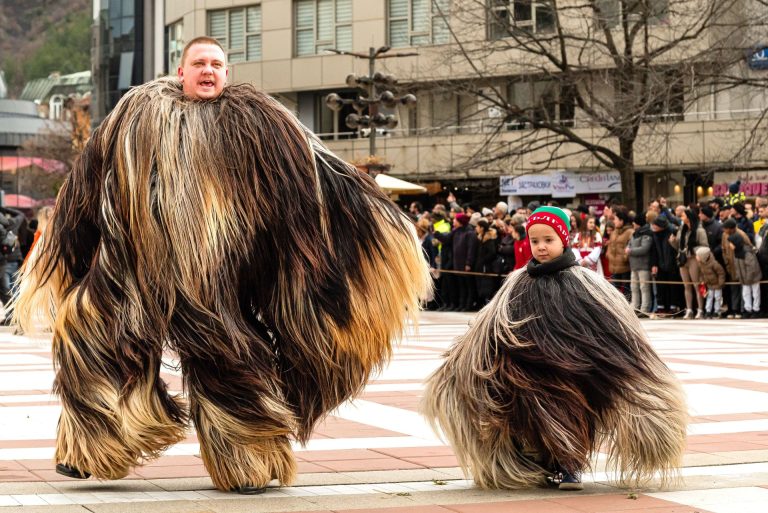 Action shot of kukeri ritual dance at a kukeri festival in Bulgaria